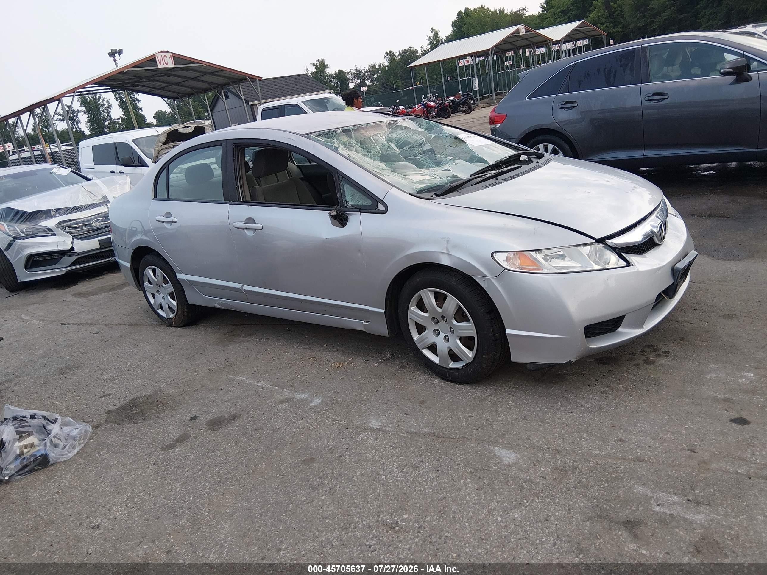 2009 Honda Civic LX, VIN 19XFA16599E018355 — Side