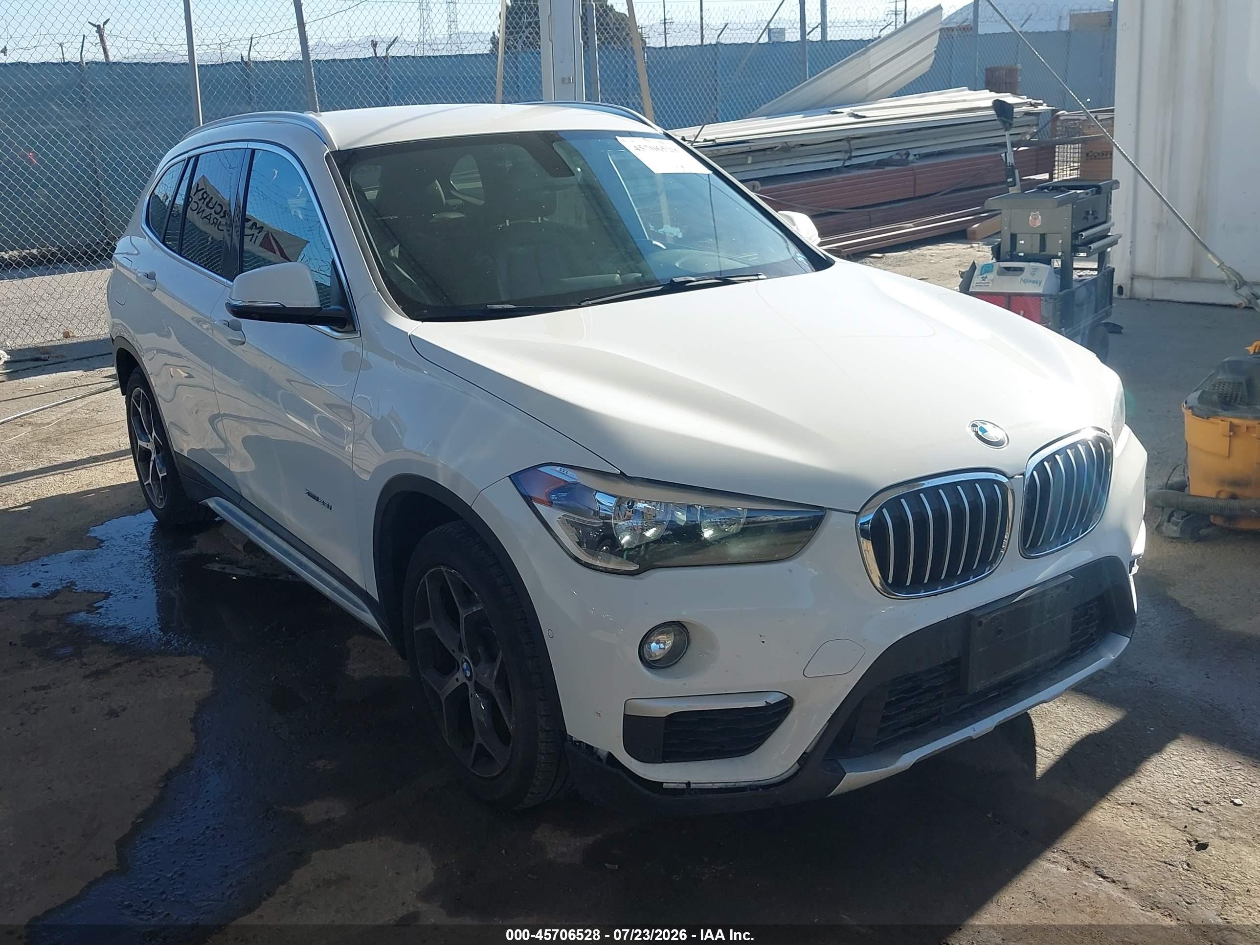 2016 BMW X1 xDrive28i, VIN WBXHT3C33G5E49967 — Rear end