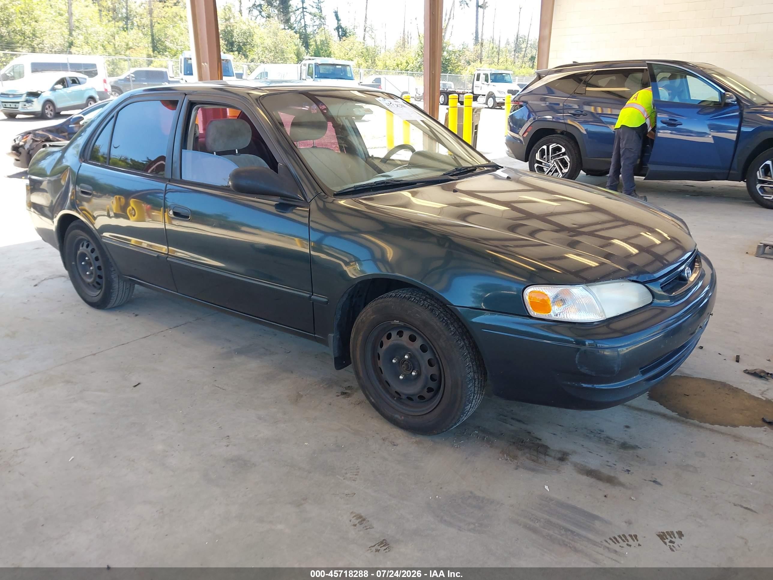 1999 Toyota Corolla LE, VIN 2T1BR12E2XC115924 — Rear end