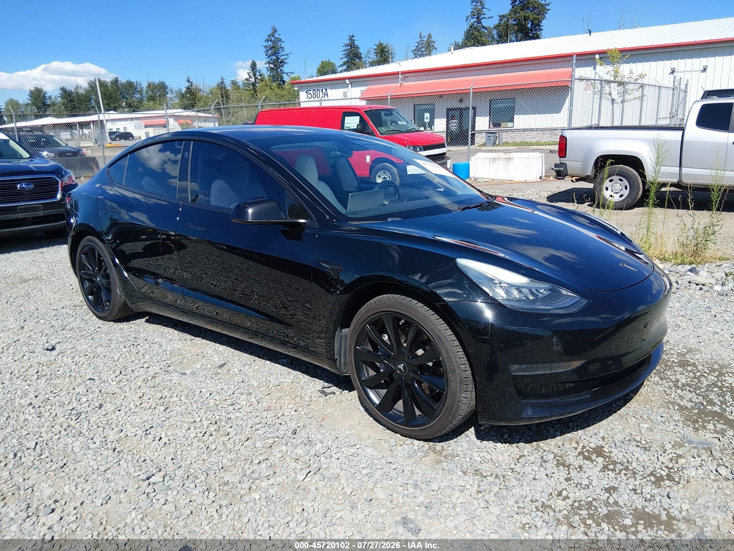 2019 Tesla Model 3 Mid Range, VIN 5YJ3E1EA7KF332706 — Side