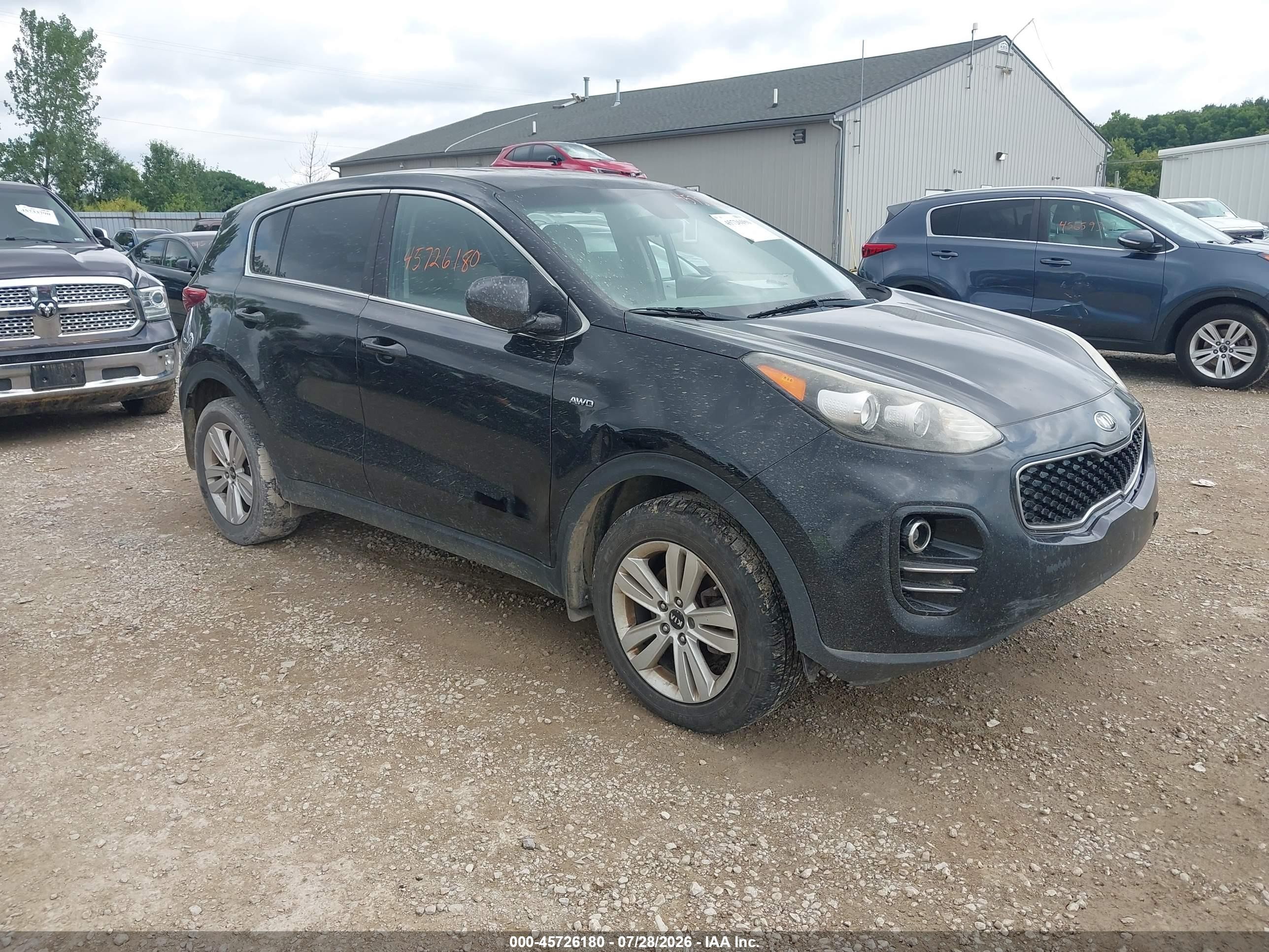 2017 Kia Sportage LX, VIN KNDPMCACXH7172990 — Side