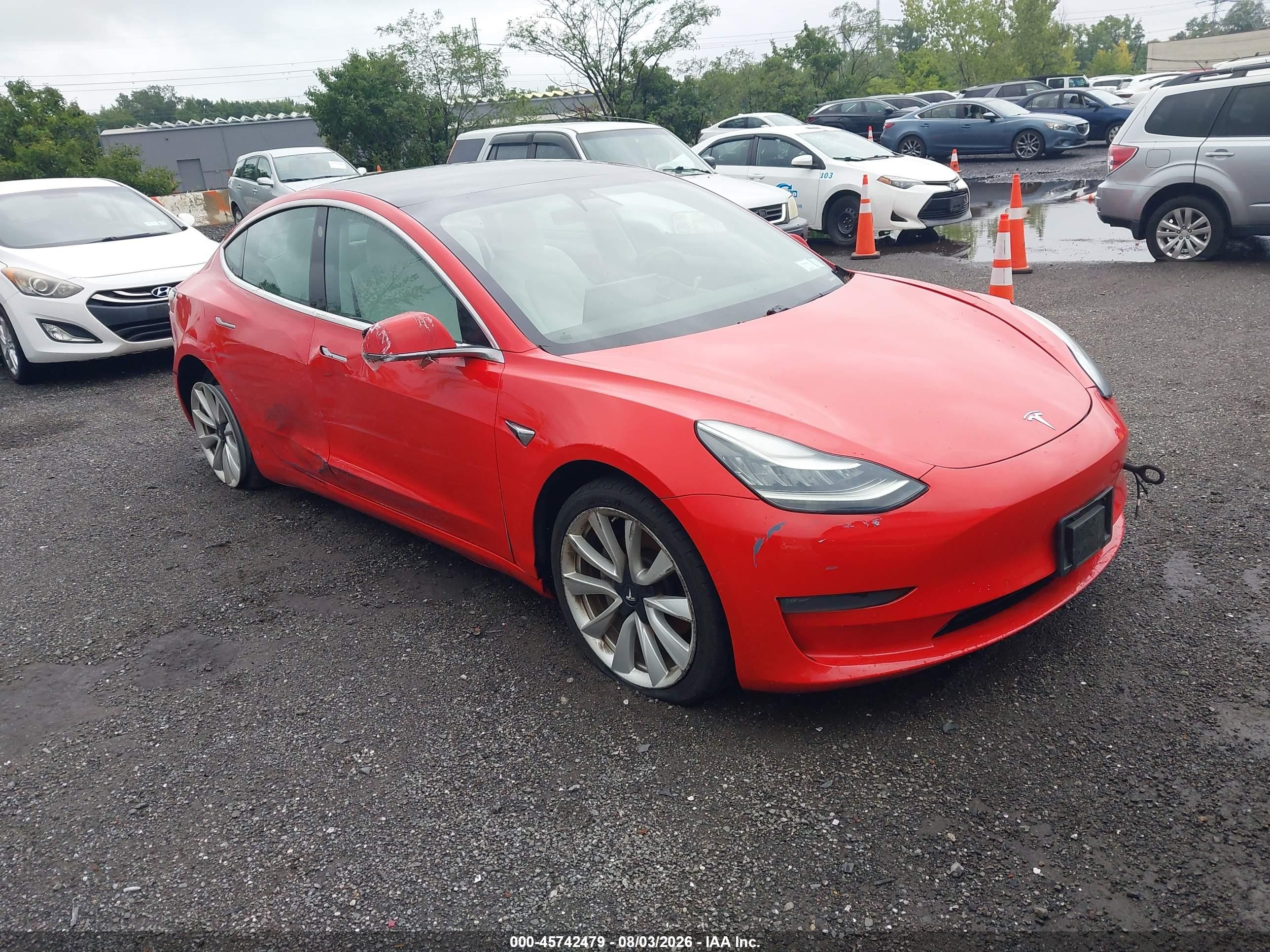 2019 Tesla Model 3 Long Range, VIN 5YJ3E1EB6KF195704 — Normal wear