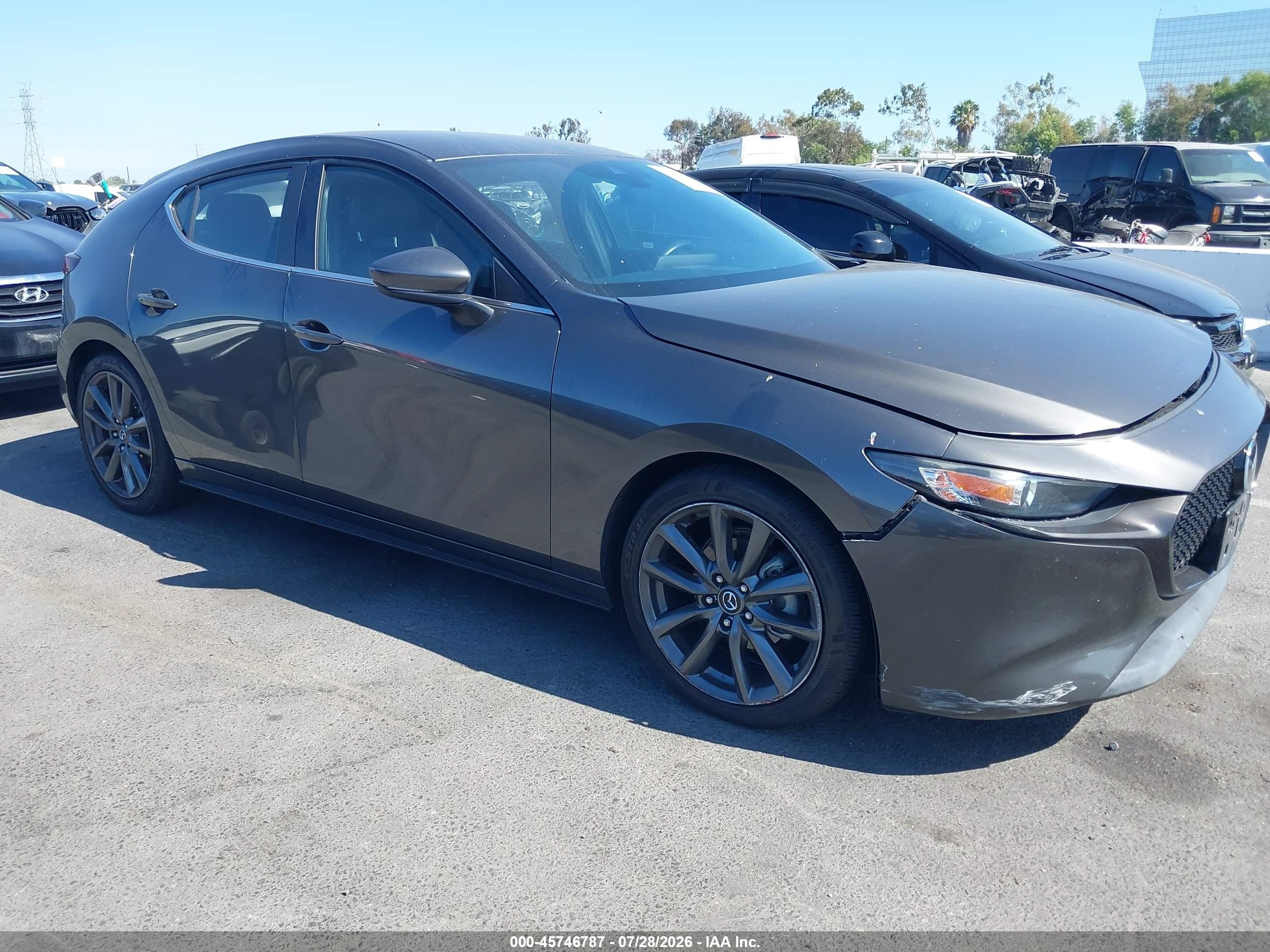 2019 Mazda 3, VIN JM1BPAJM0K1119336 — Side