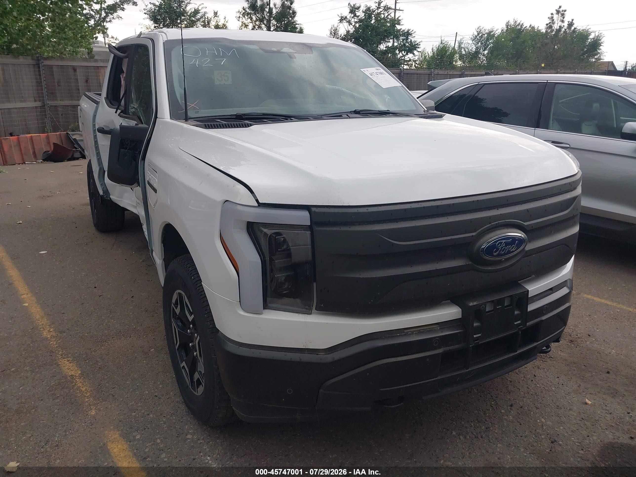 2023 Ford F-150 Lightning Lariat, VIN 1FT6W1EV3PWG31786 — Side