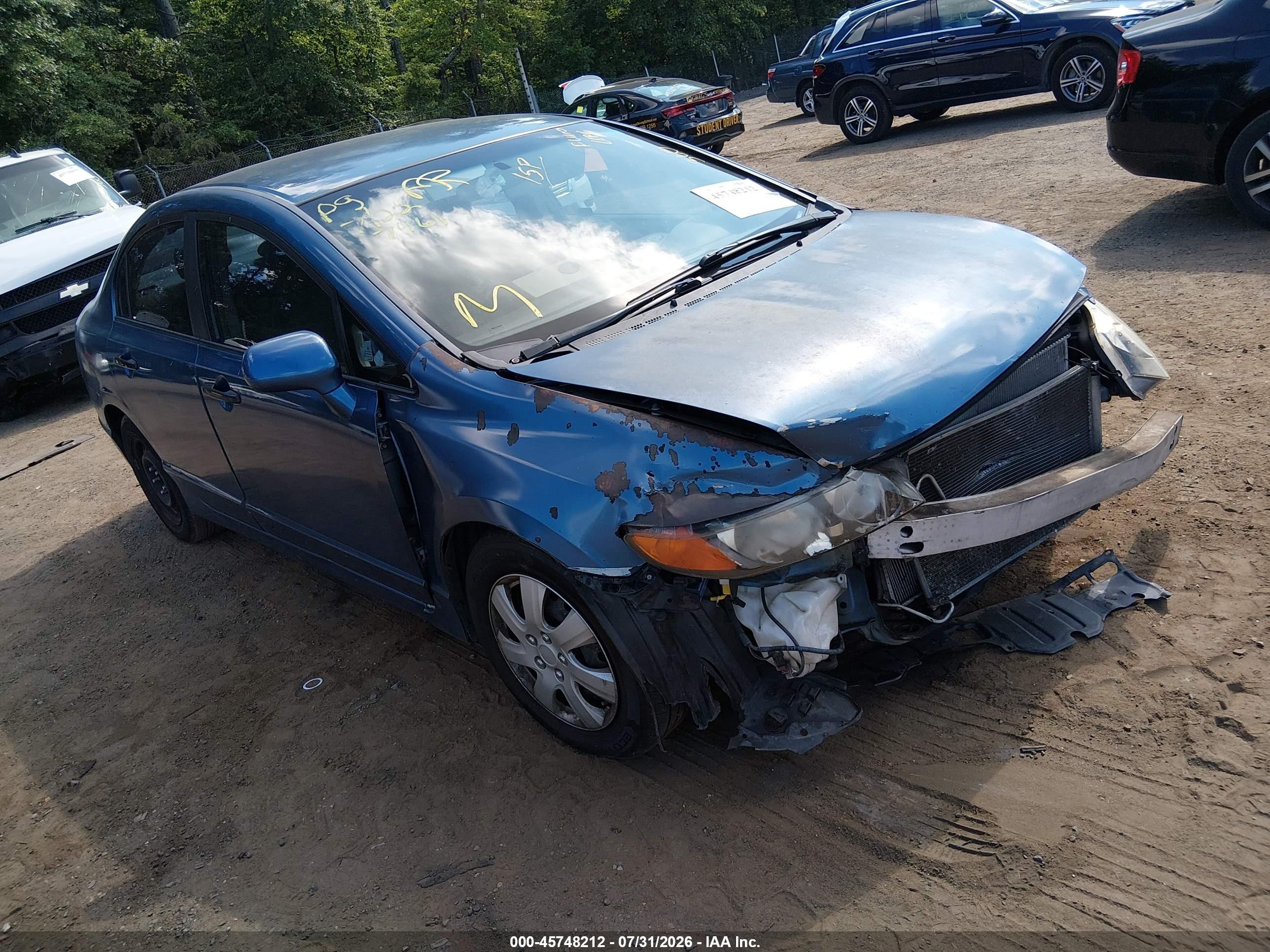 2010 Honda Civic DX-VP, VIN 19XFA1F31AE057461 — Front end