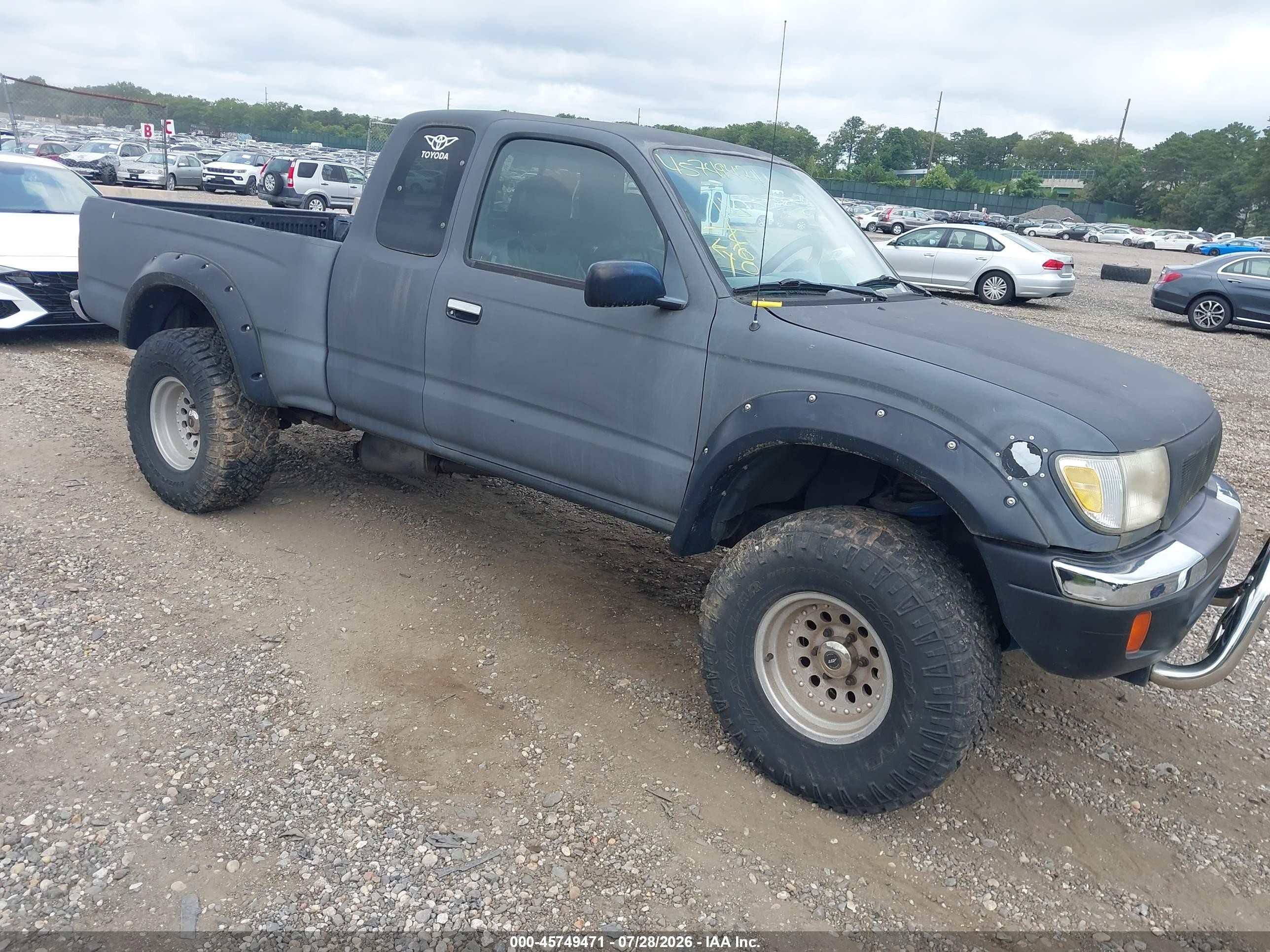 1999 Toyota Tacoma, VIN 4TAWM72N4XZ502480 — Normal wear
