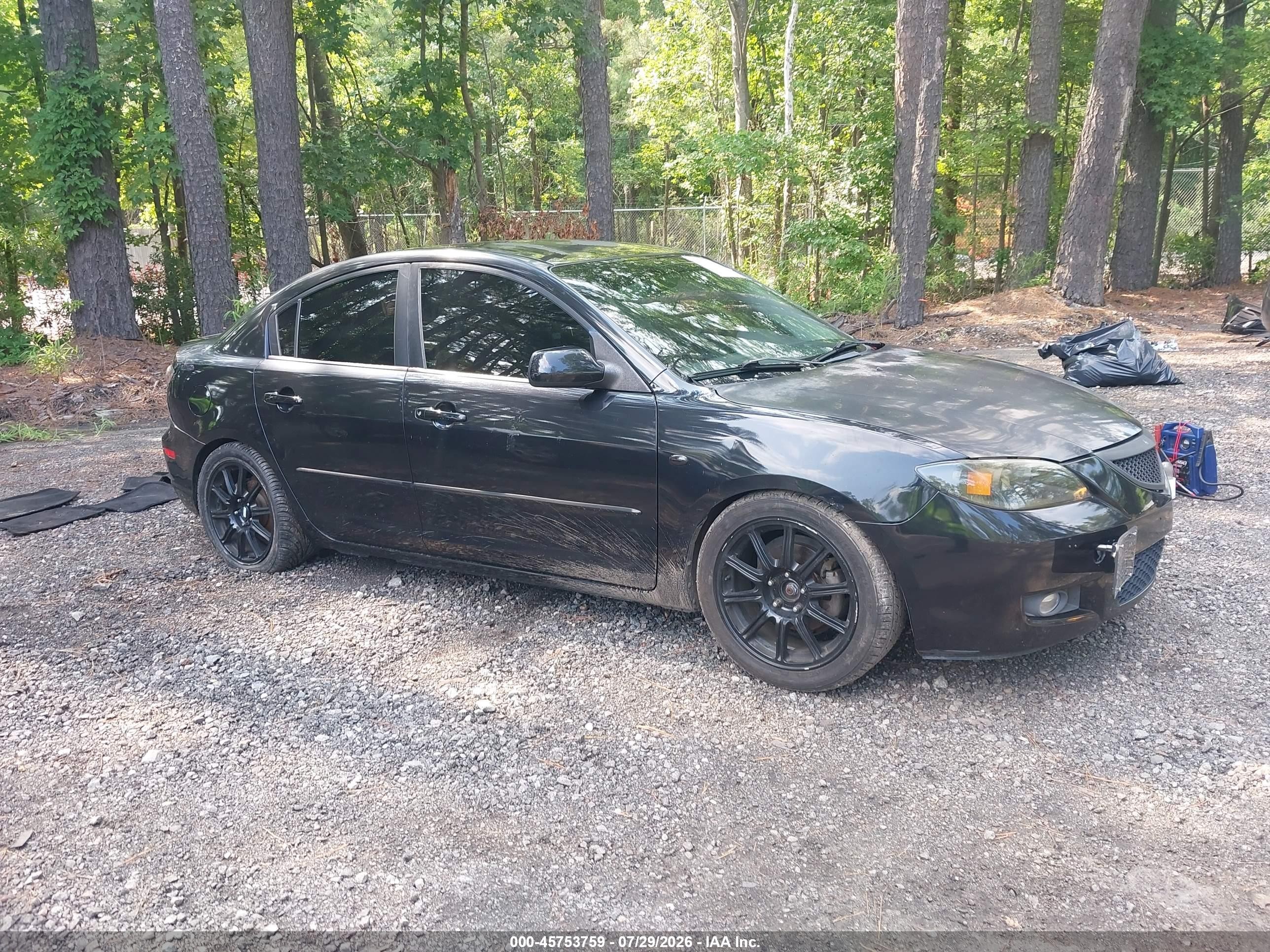 2009 Mazda 3 i Sport, VIN JM1BK32F491238785 — Side