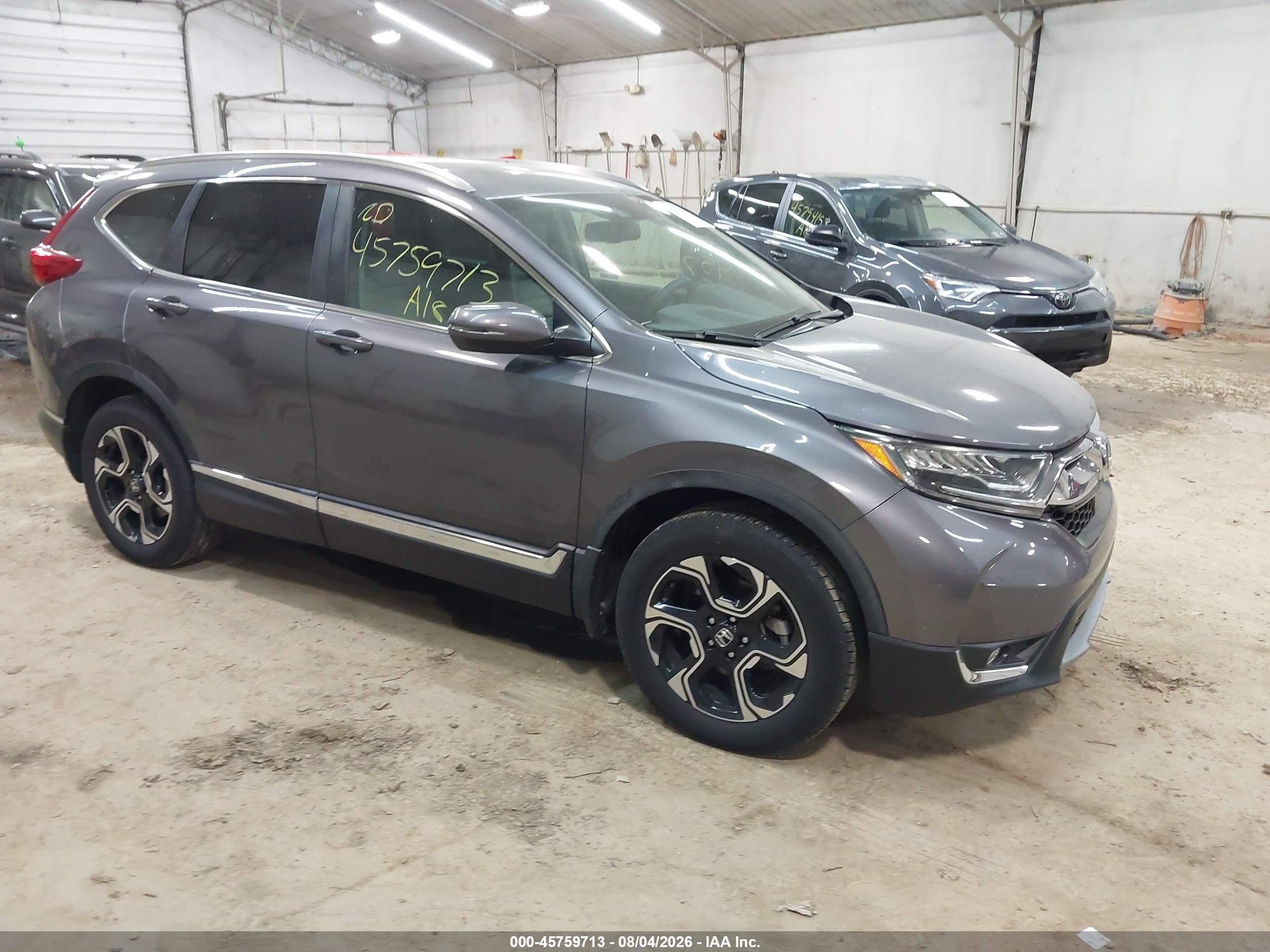 2018 Honda CR-V Touring, VIN 2HKRW2H94JH676850 — Hail