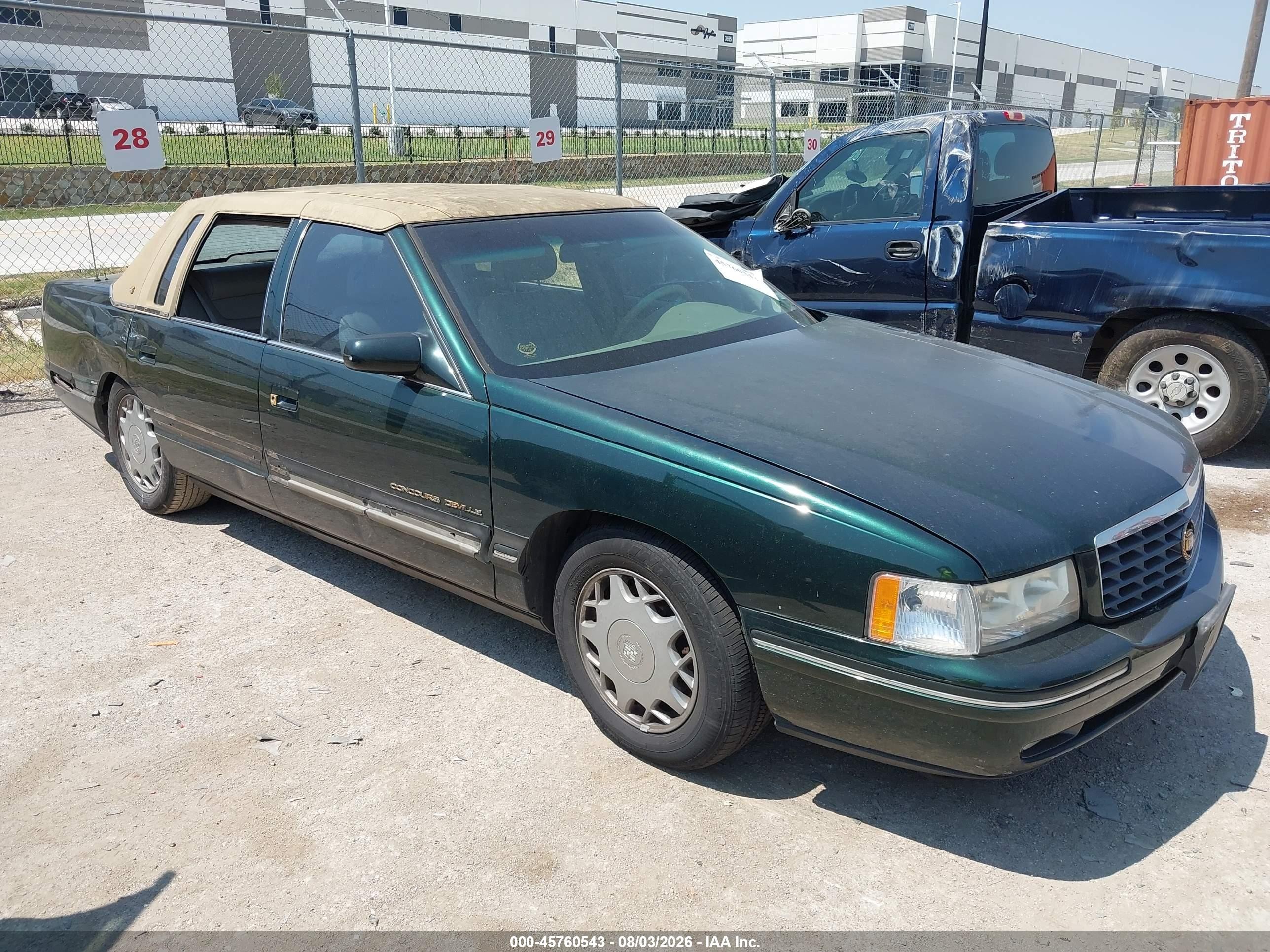 1997 Cadillac DeVille, VIN 1G6KF5294VU222317 — Side