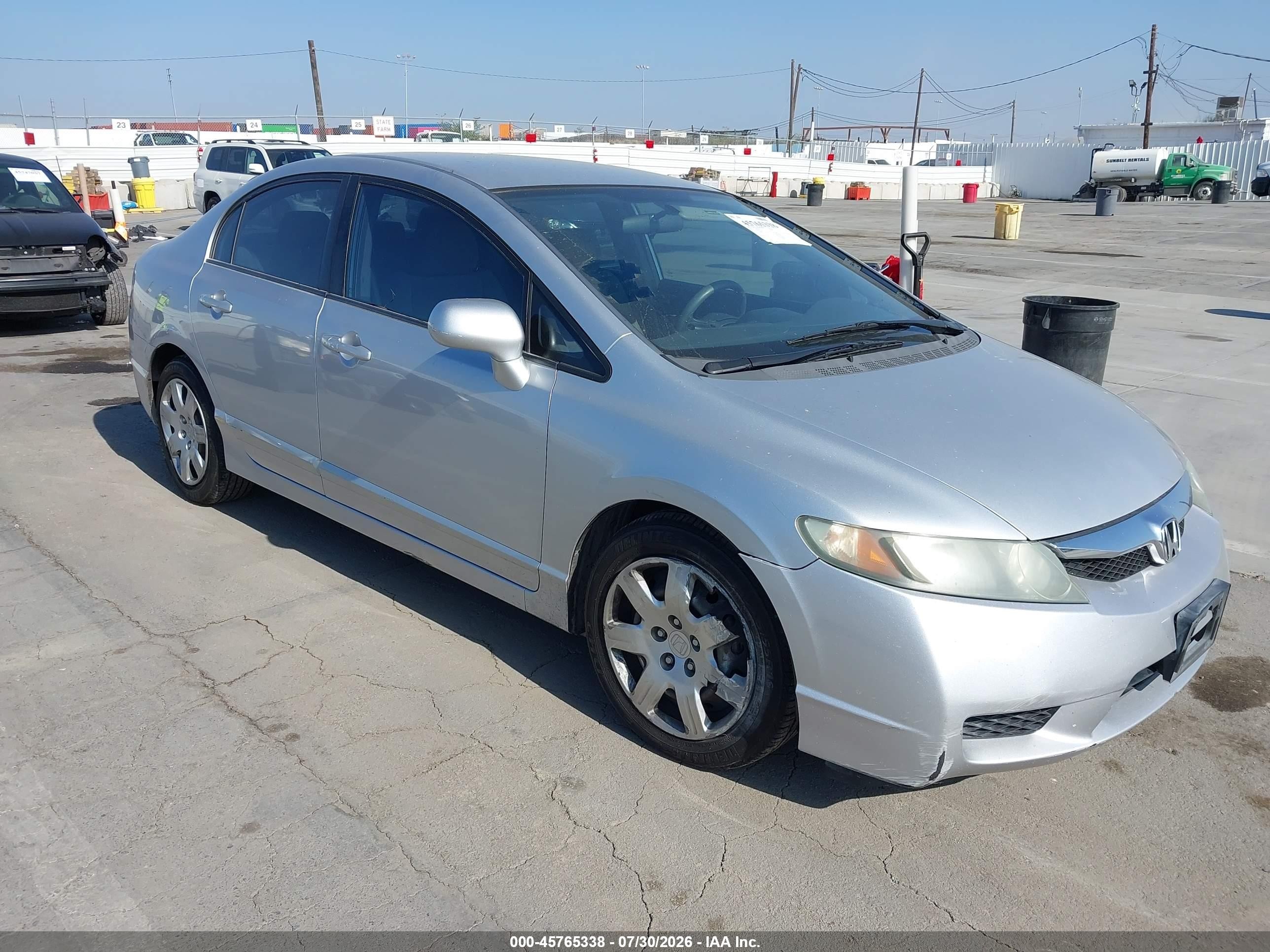 2010 Honda Civic LX, VIN 2HGFA1F52AH305143 — Side