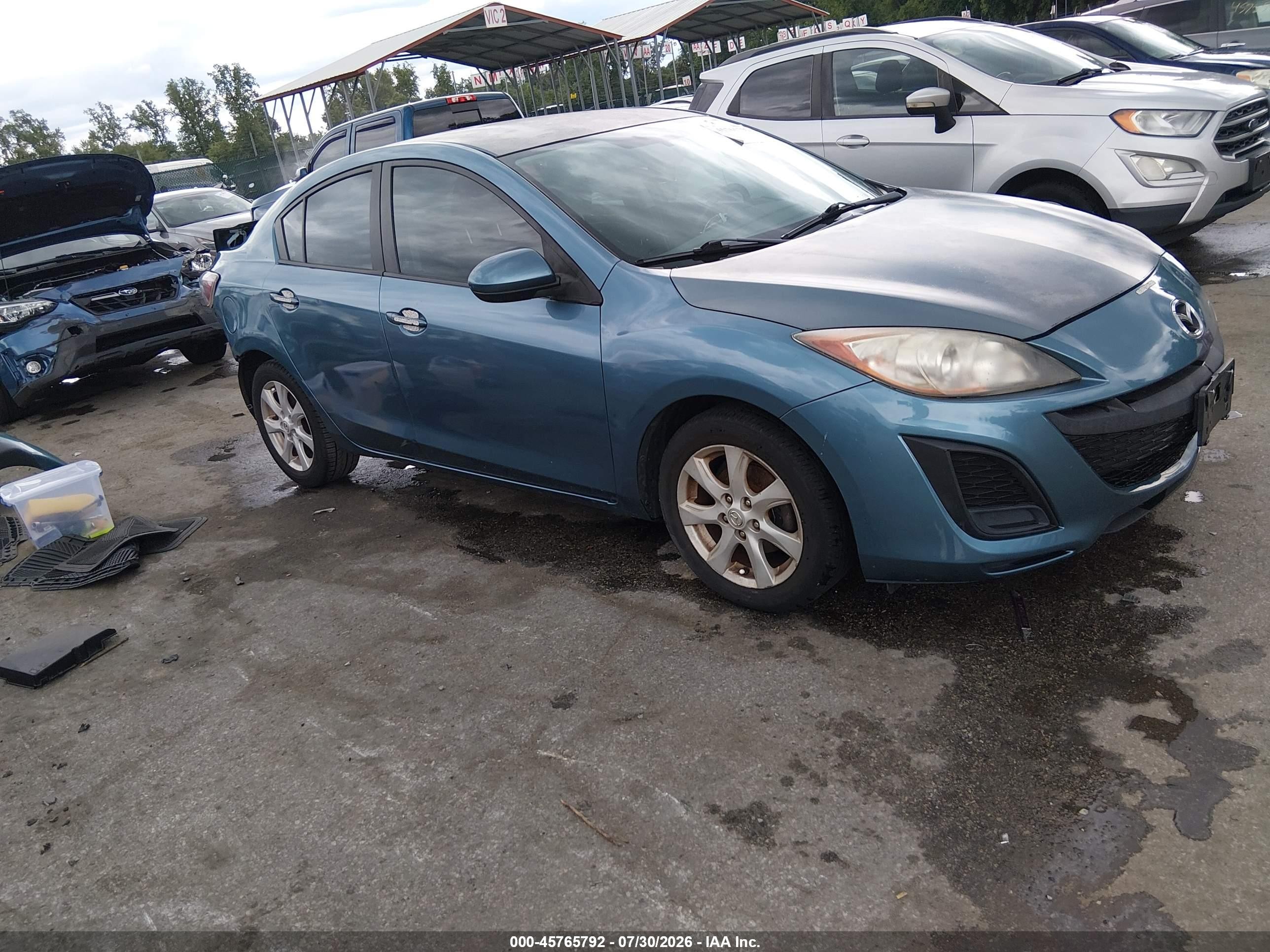 2011 Mazda 3 i Touring, VIN JM1BL1VG1B1447185 — Side