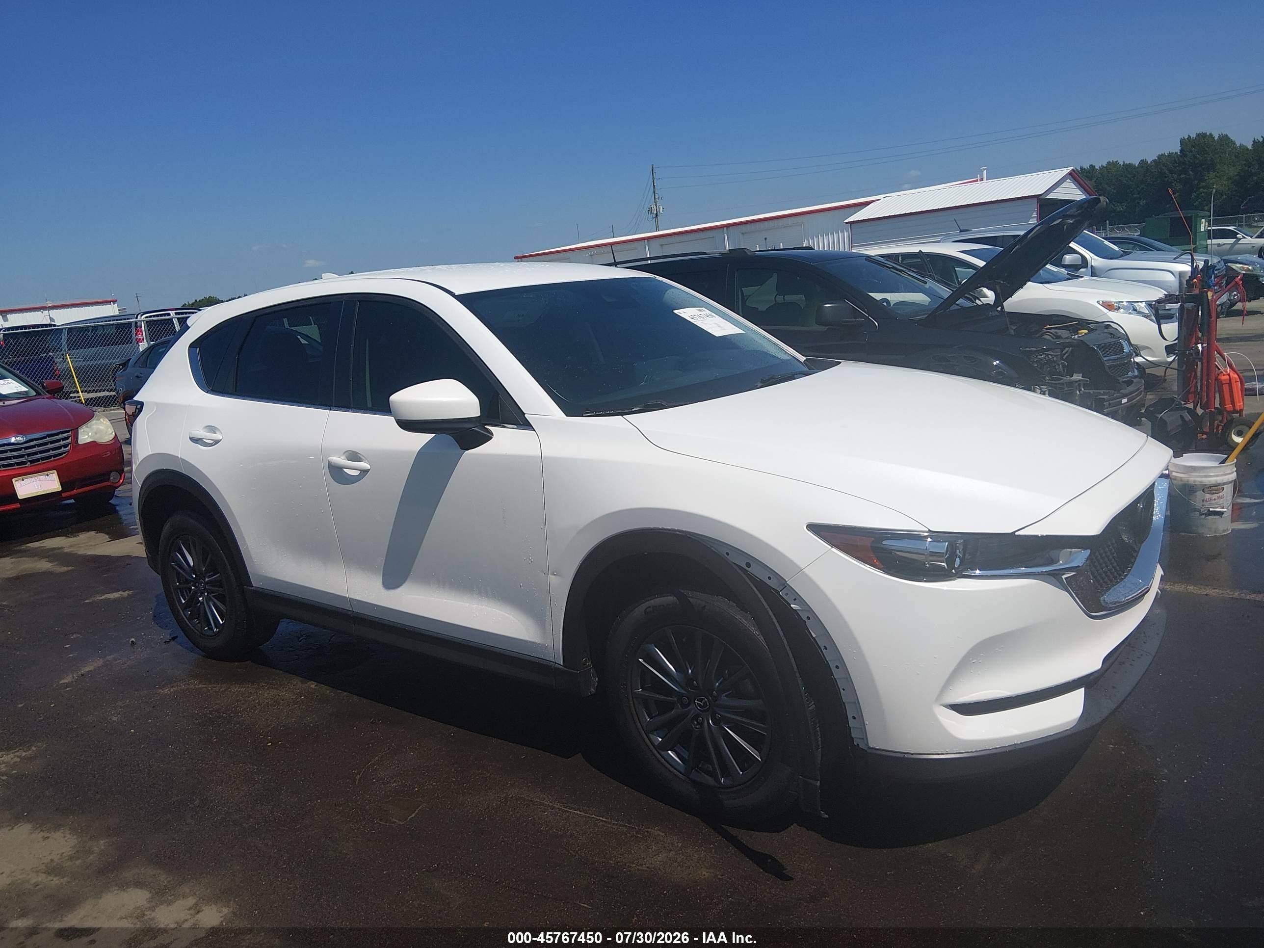 2021 Mazda CX-5 Sport, VIN JM3KFABM1M0361263 — Rear end