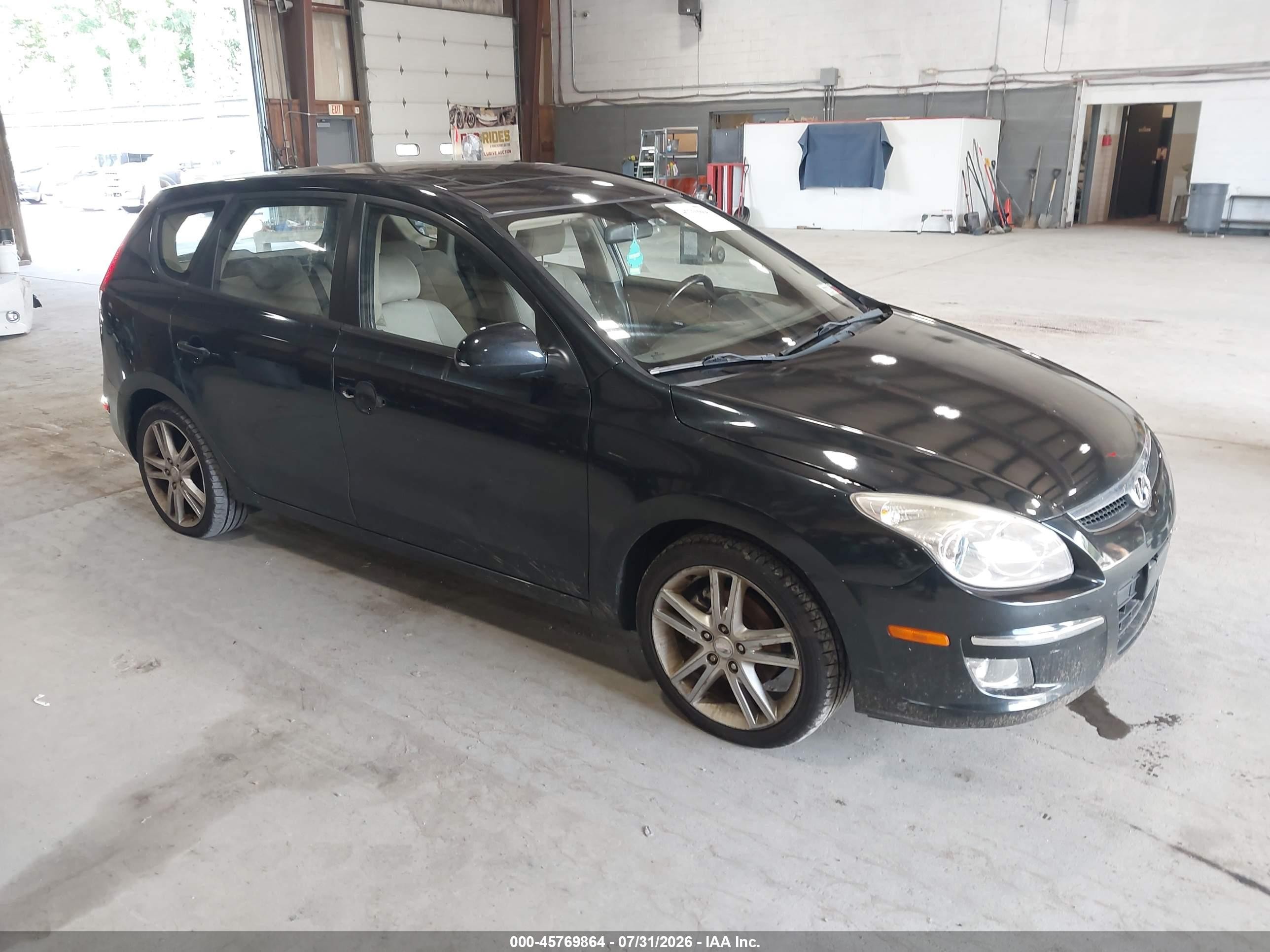 2009 Hyundai Elantra Touring, VIN KMHDC86E59U048914 — Normal wear