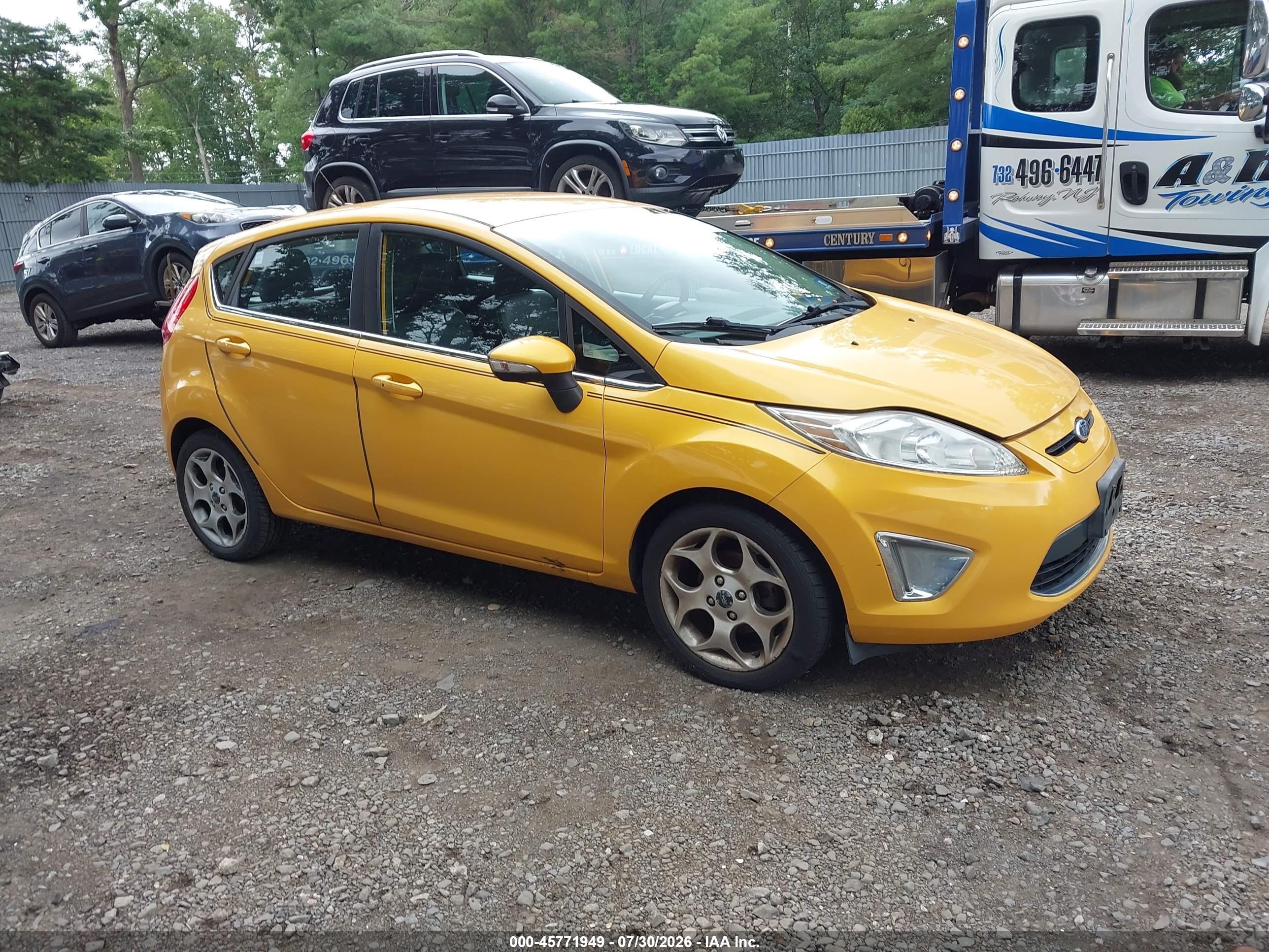 2011 Ford Fiesta SES, VIN 3FADP4FJ0BM113148 — Normal wear