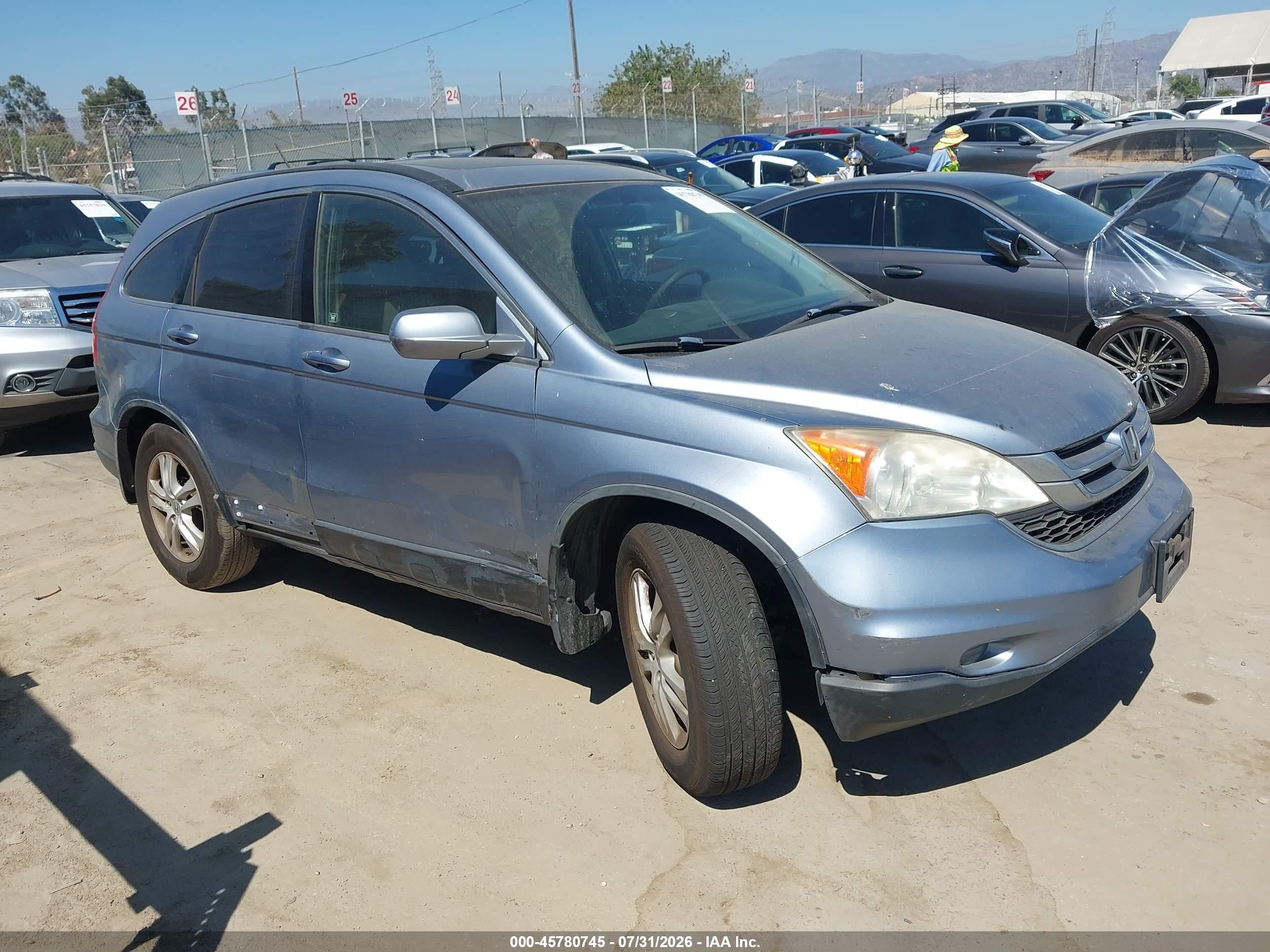 2011 Honda CR-V EX-L, VIN JHLRE4H71BC001017 — Side