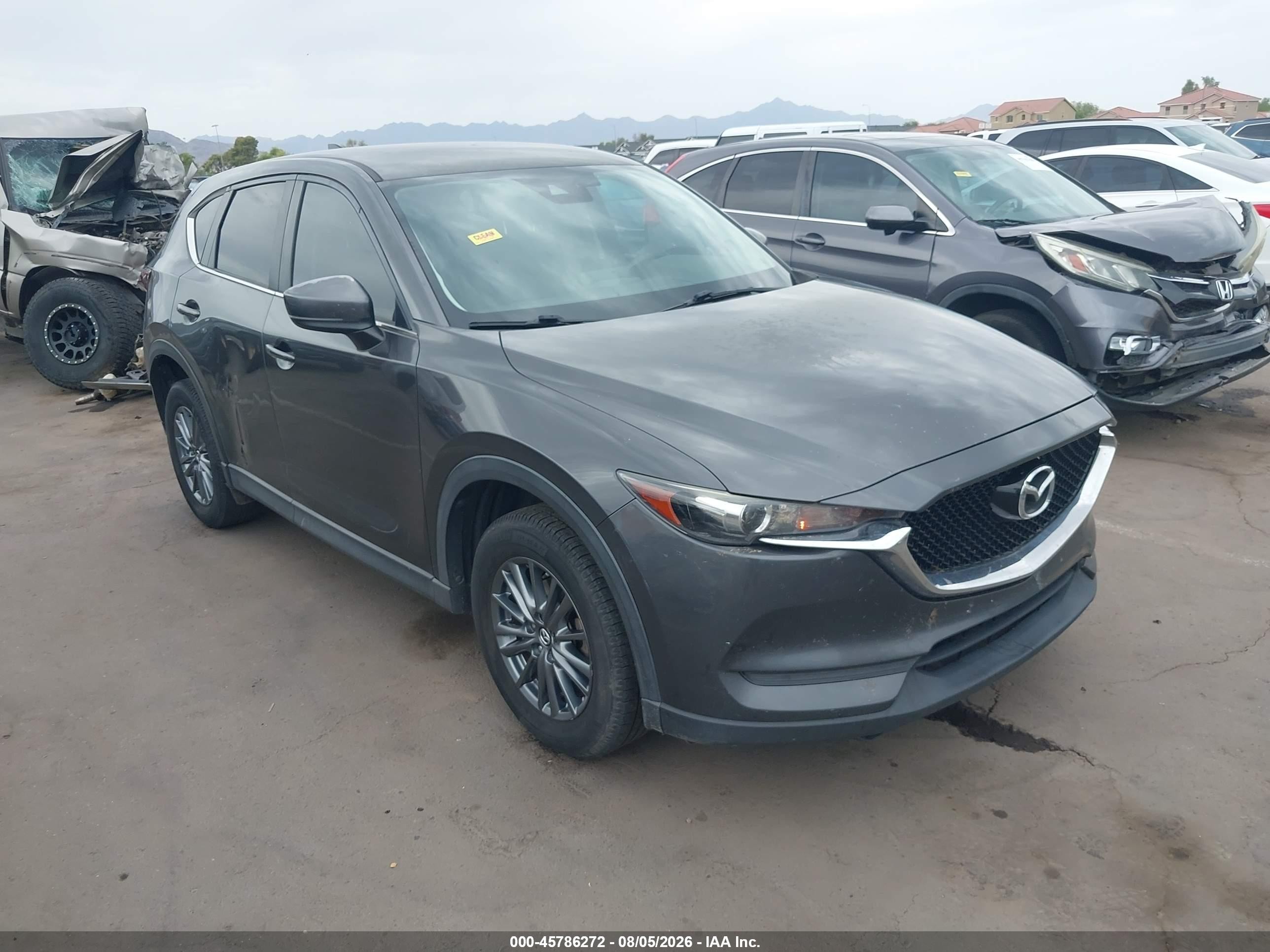 2017 Mazda CX-5 Touring, VIN JM3KFACL8H0163405 — Бок