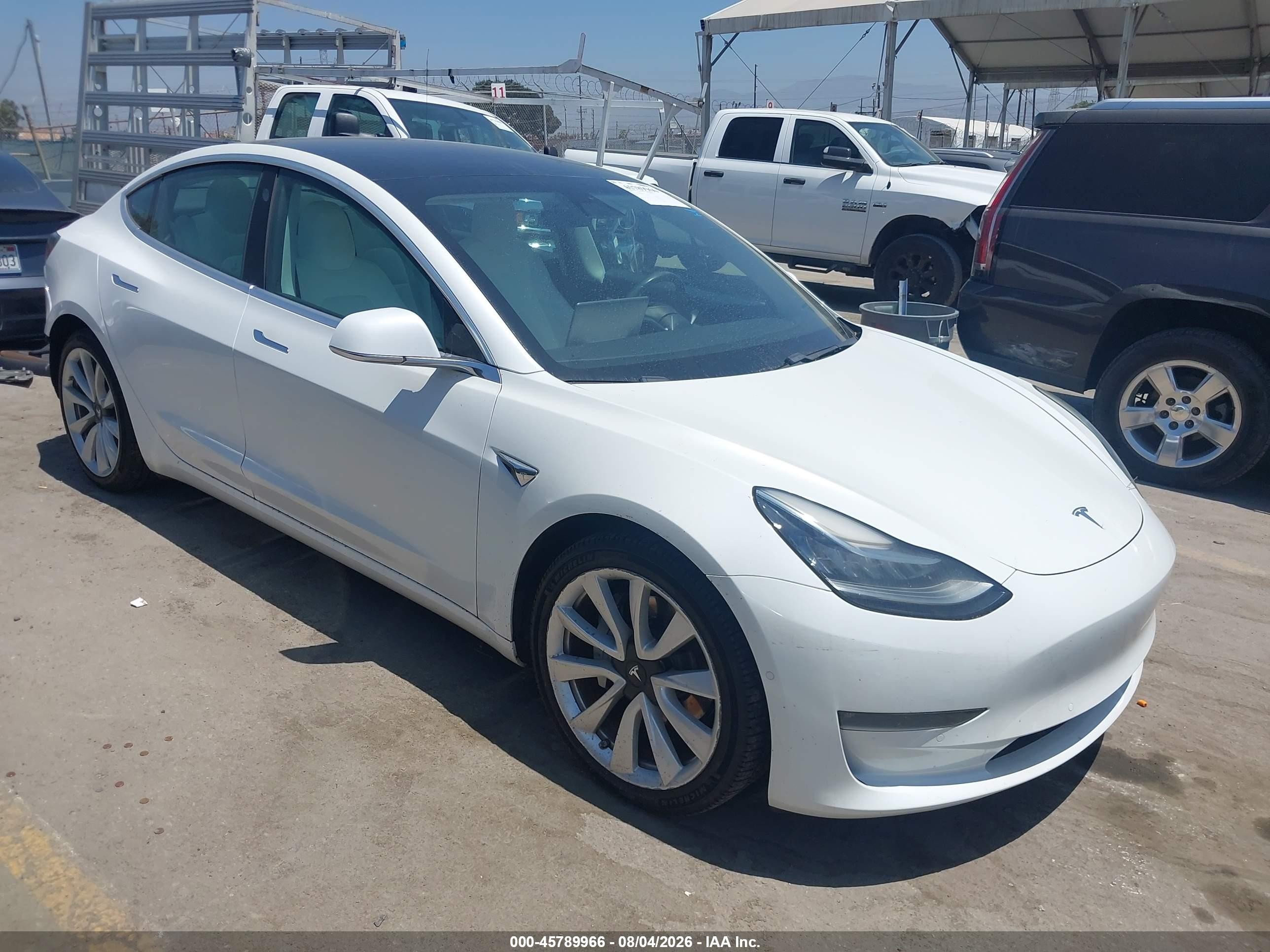 2019 Tesla Model 3 Long Range, VIN 5YJ3E1EB9KF407009 — Зад