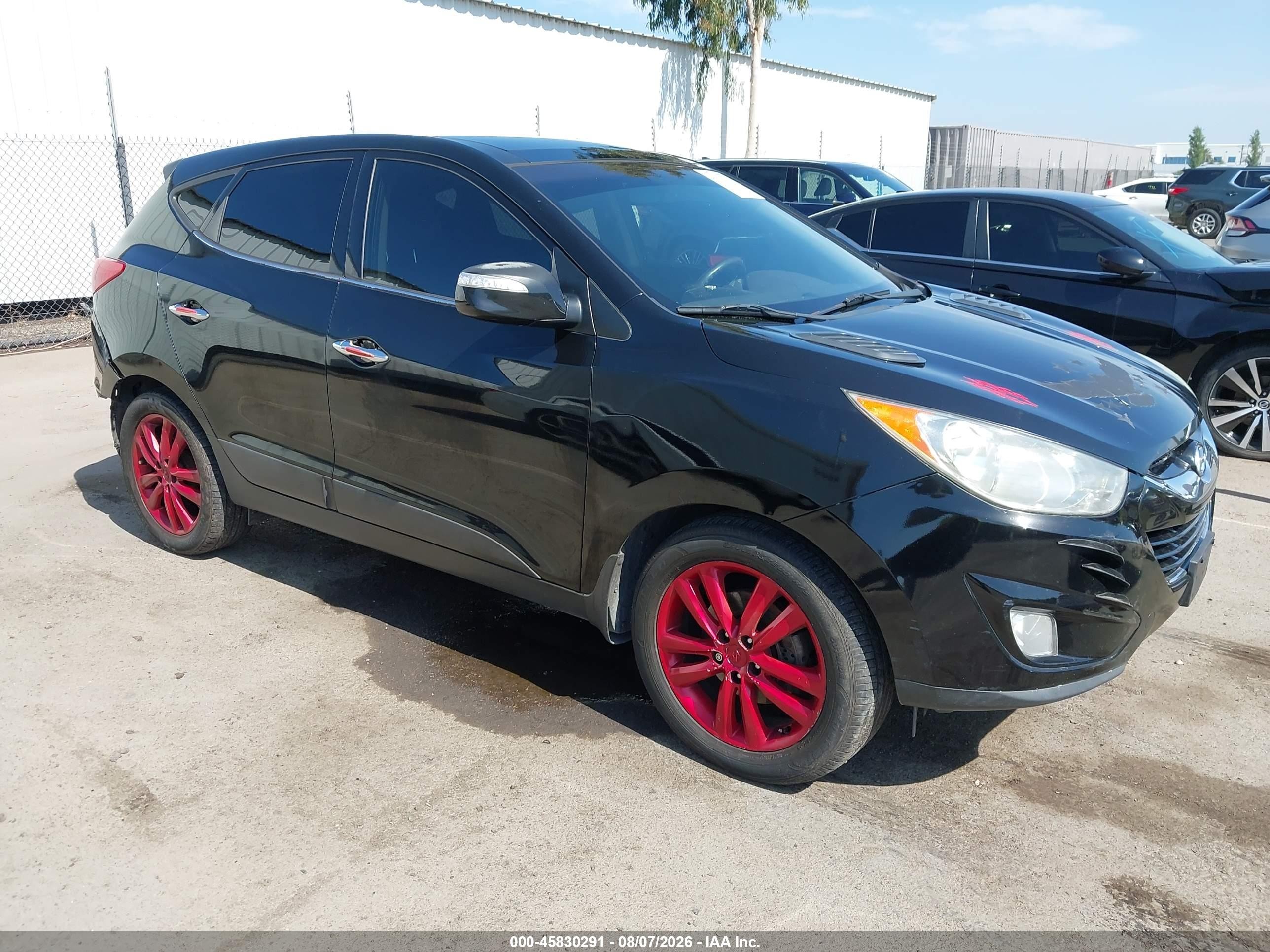 2013 Hyundai Tucson Limited, VIN KM8JU3AC0DU616424 — Rear end