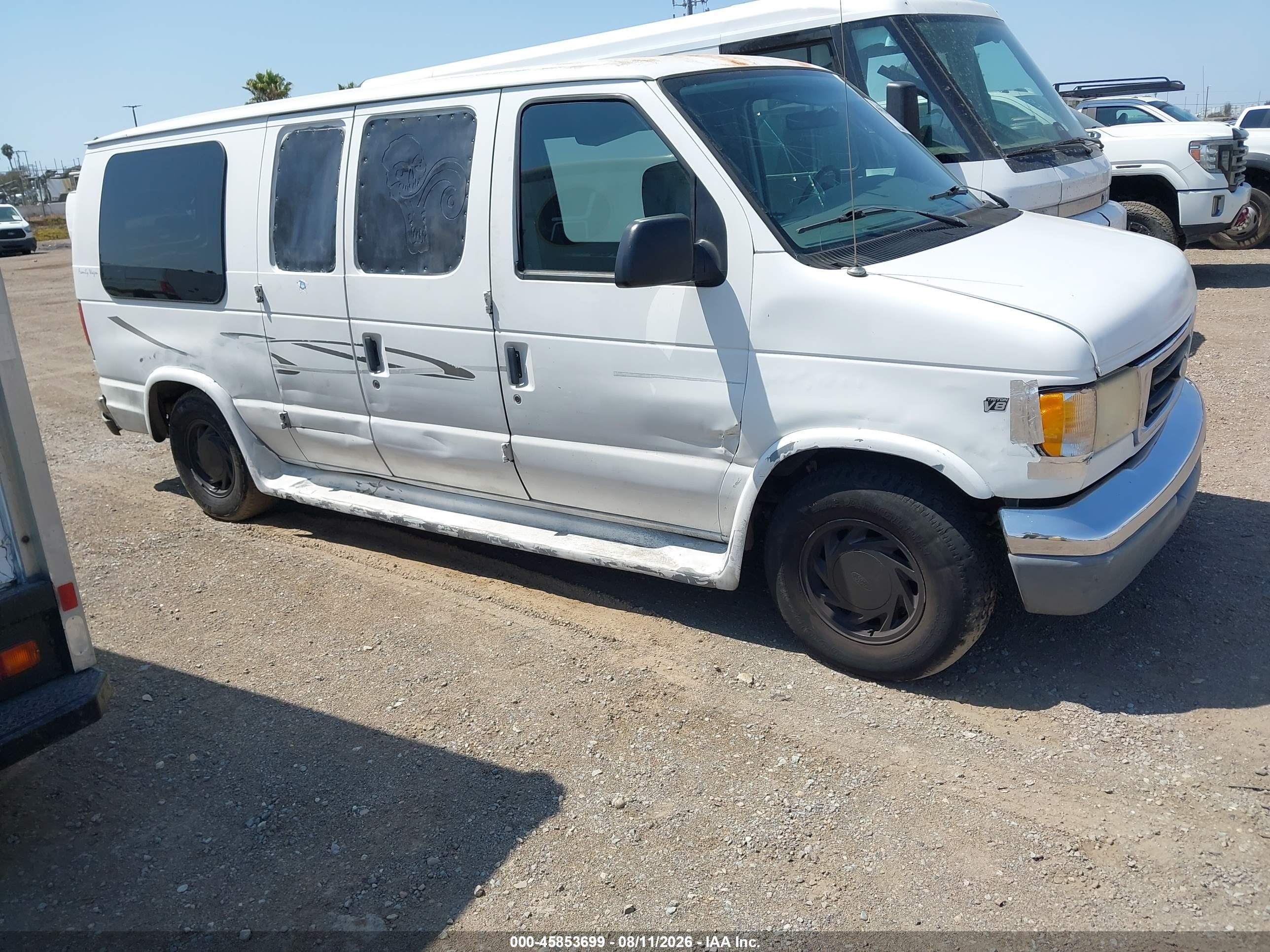 1999 Ford Econoline Cargo, VIN 1FDRE14L3XHA32578 — Not stated