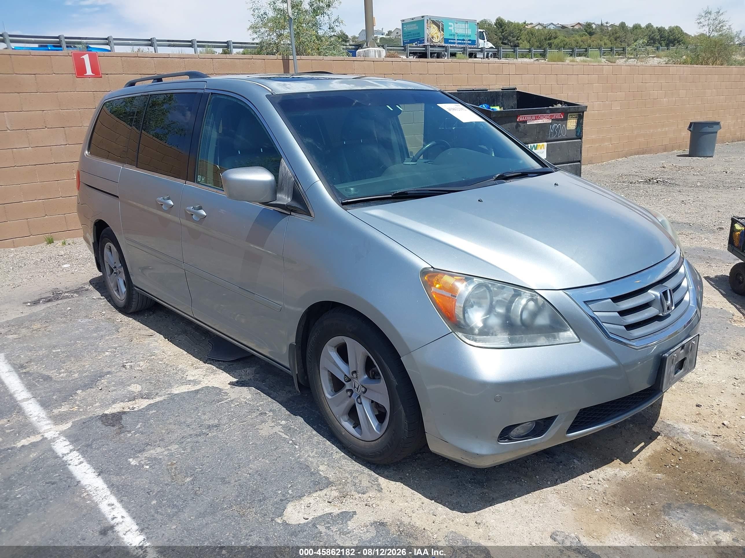 2010 Honda Odyssey Touring, VIN 5FNRL3H9XAB096953 — Side